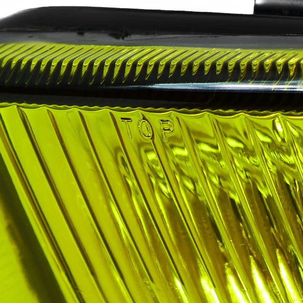 Close-up of JDM CARBOY H3 yellow fog light lens, chrome housing